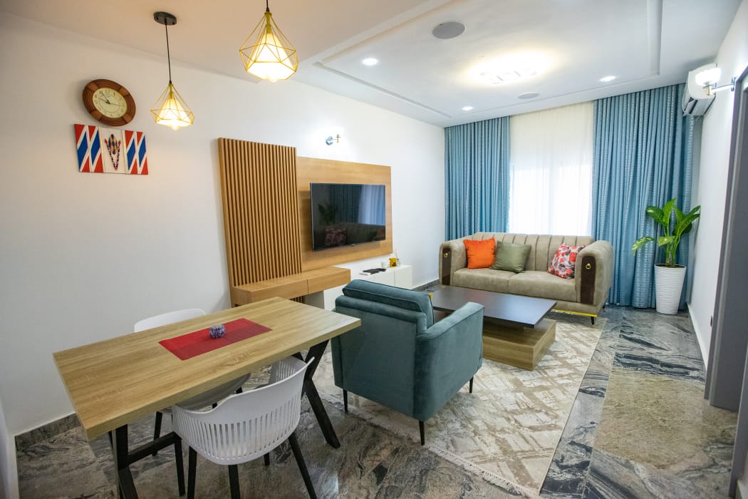 Dining table and living area inside a Dawn residence