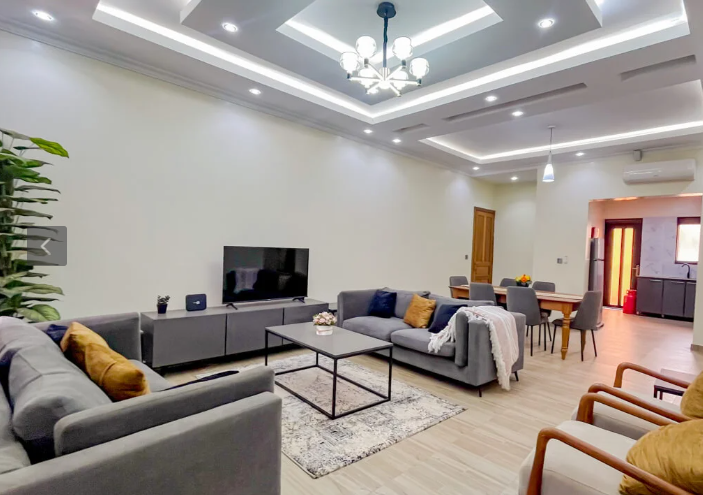 Furnished living and dining space inside a Kigali residence